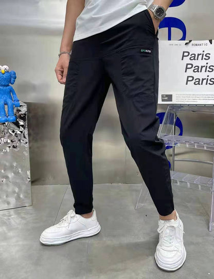 Pantalones casuales de alta elasticidad con bordado de seis bolsillos y costura de seda de hielo para hombres